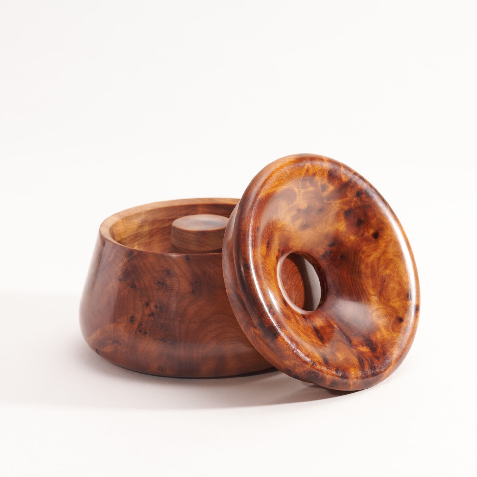 Wooden container with a lid on a white background