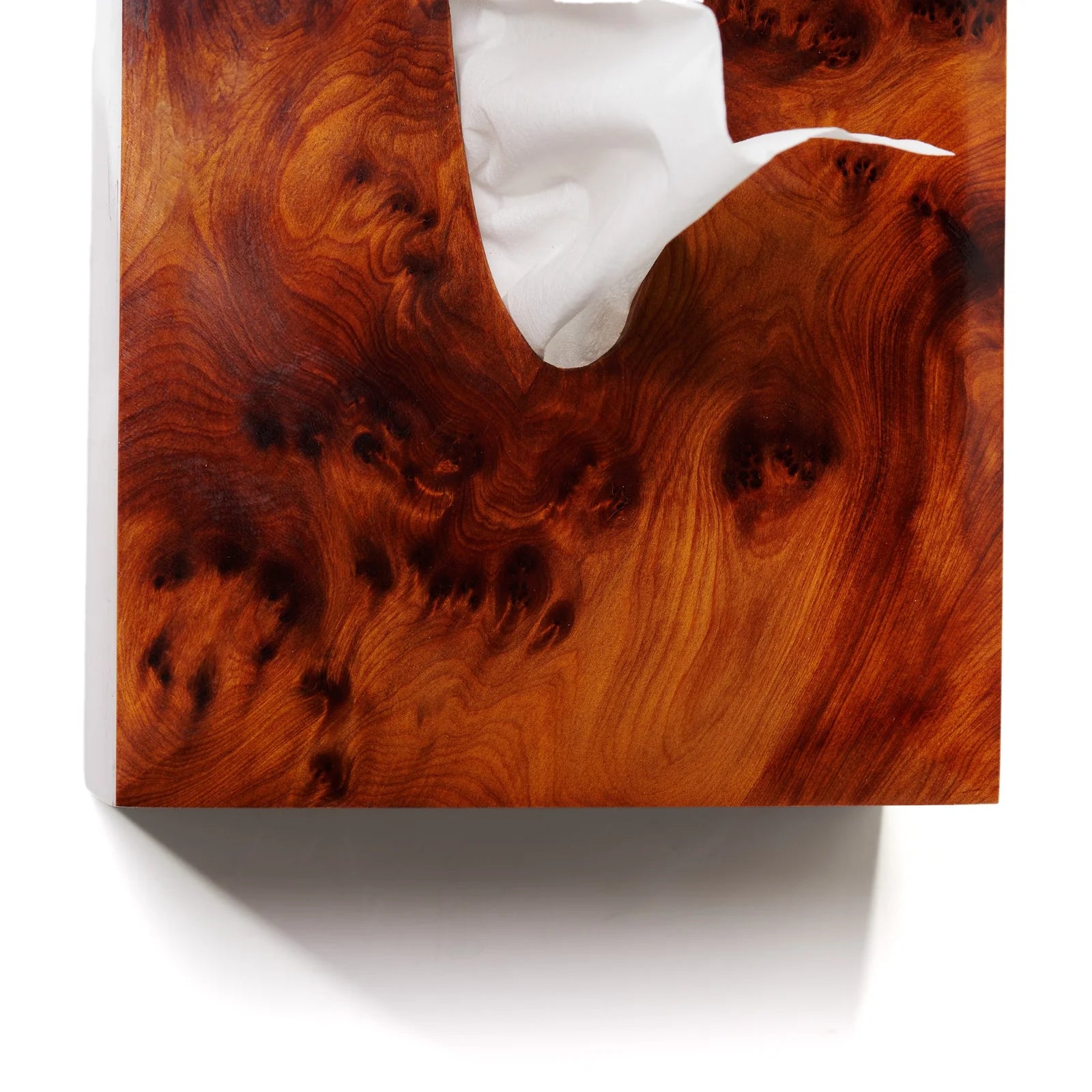 Wooden cutting board with a white napkin on a white background