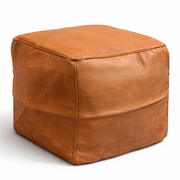 Brown leather cube ottoman on a white background