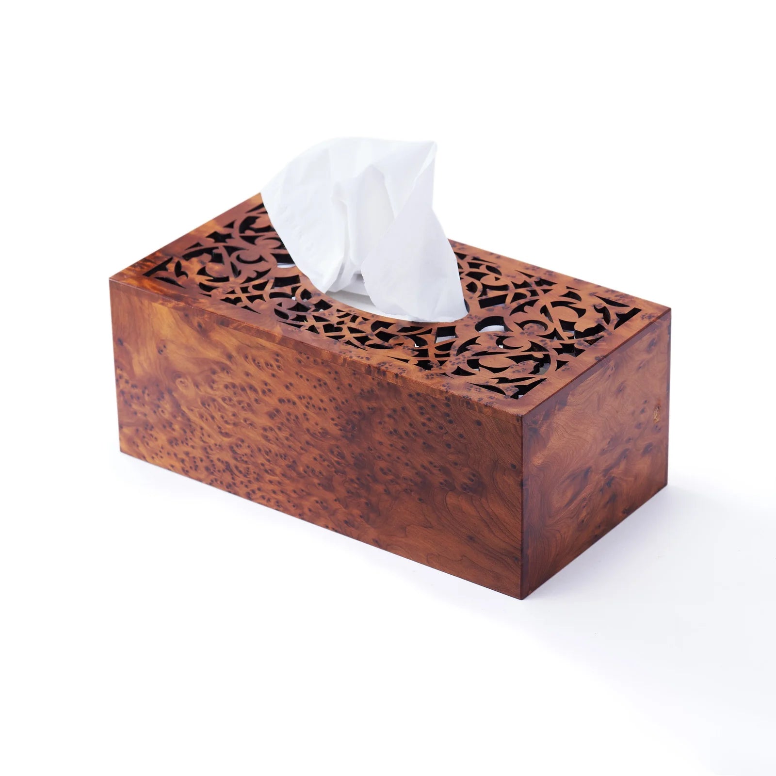 Wooden tissue box with intricate carvings on a white background