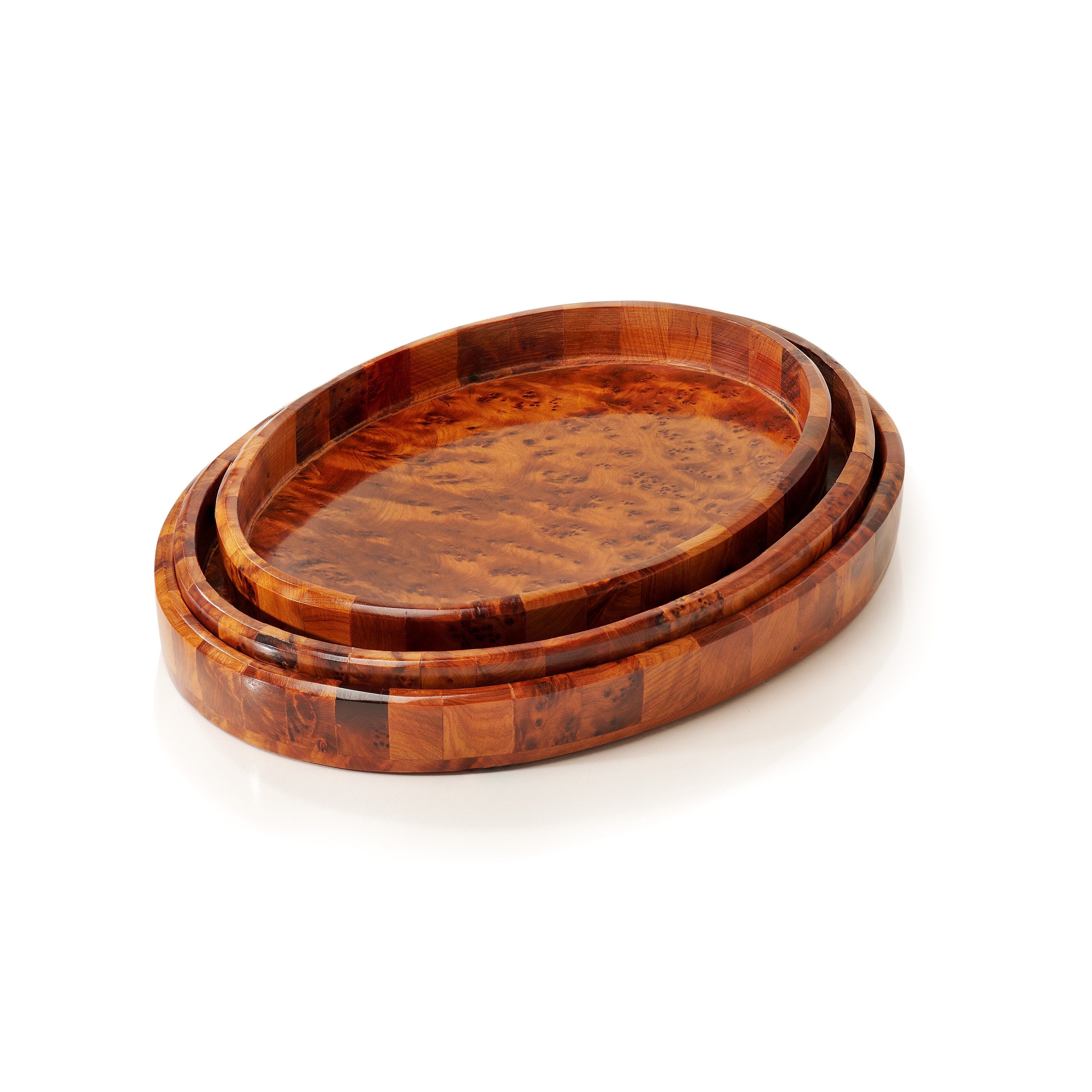 Set of three wooden trays with a natural grain pattern on a white background