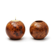 Two wooden candle holders on a white background