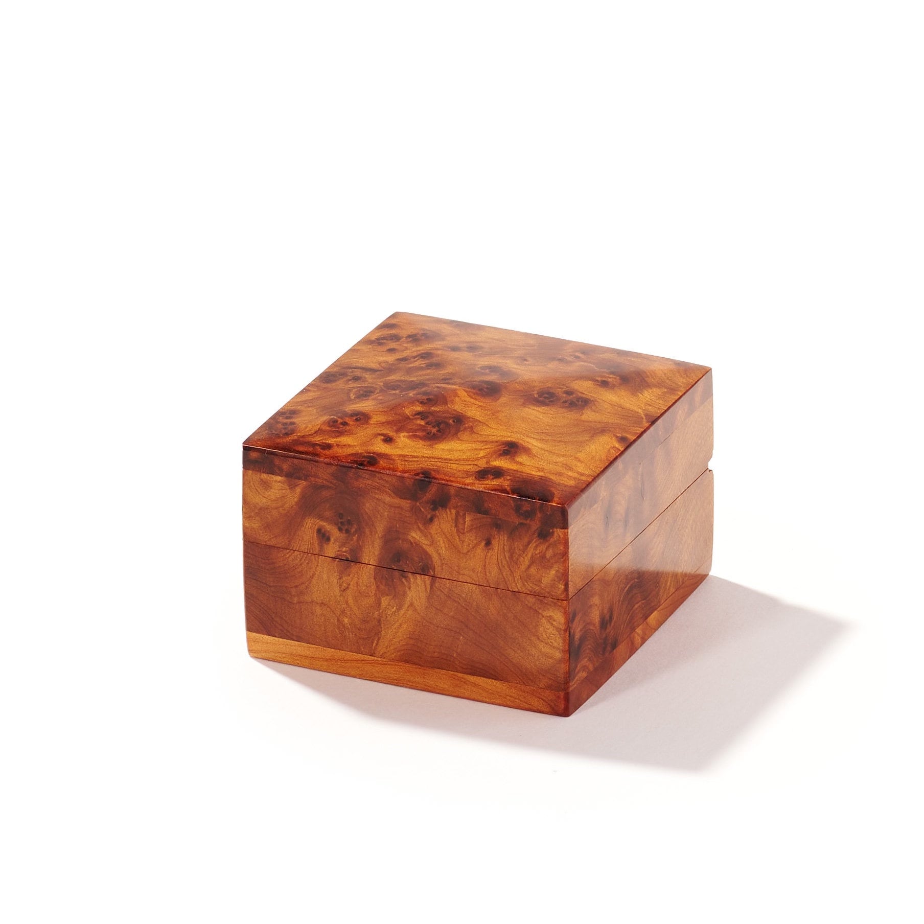 Wooden jewelry proposal ring box with a burl pattern on a white background