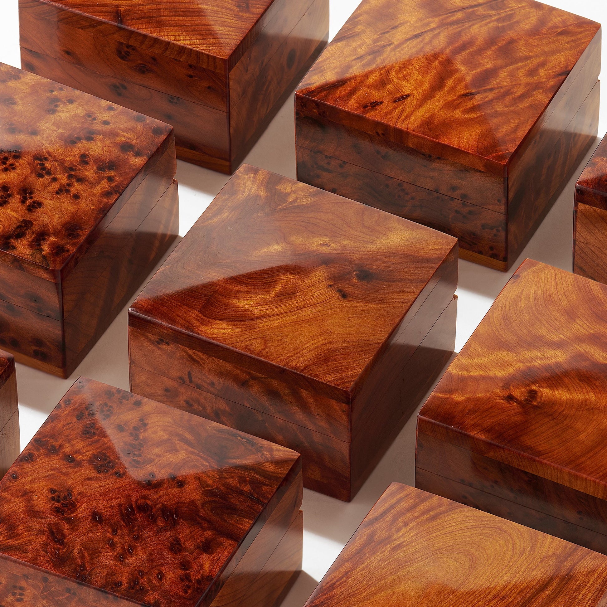 Wooden boxes with a burl pattern on a reflective surface