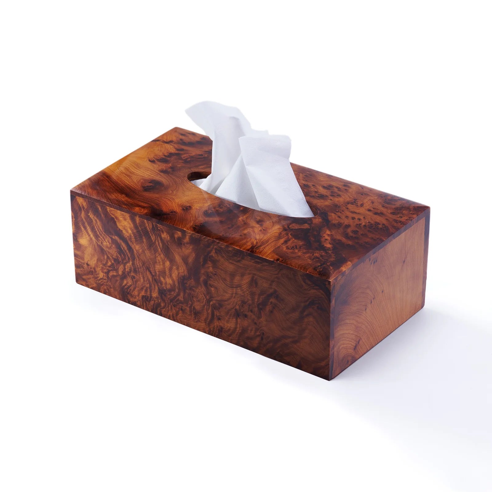 Wooden tissue box cover with tissues on a white background
