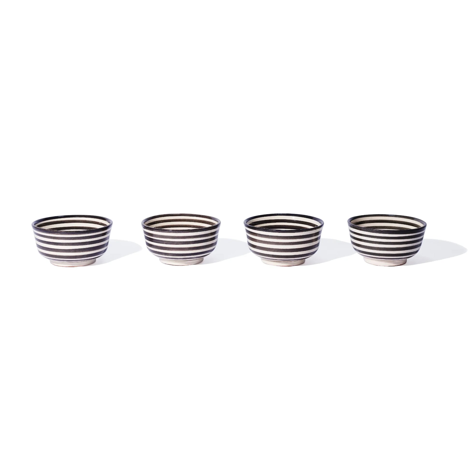 set of 4 ceramic striped soup bowls on a white background