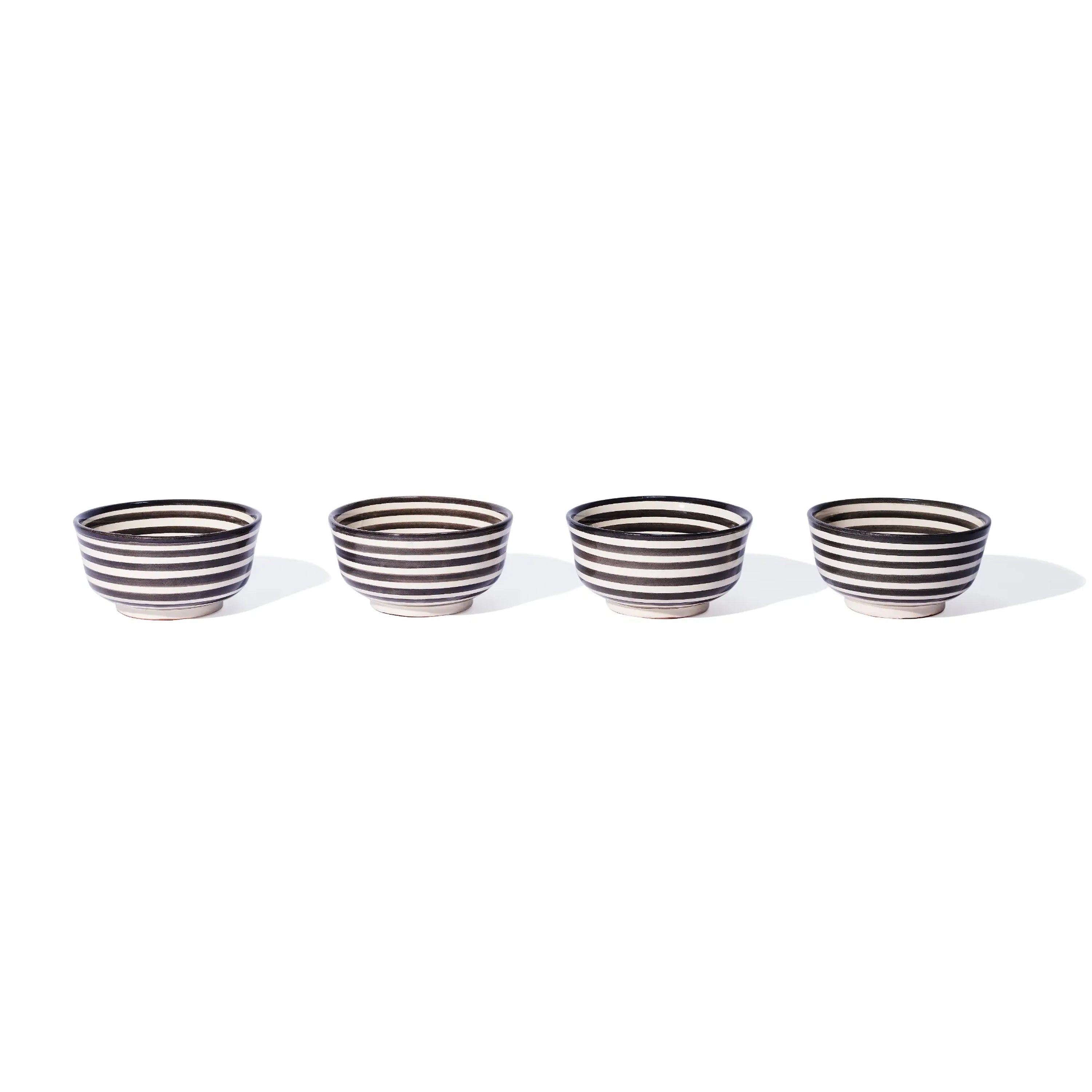 set of 4 ceramic striped soup bowls on a white background